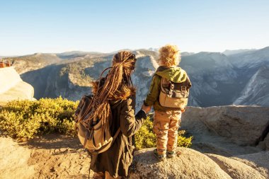 Mother with  son visit Yosemite national park in California clipart