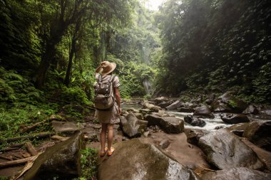 Woman near Nung Nung waterfal on Bali, Indonesia