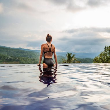 Beautiful woman by the pool
