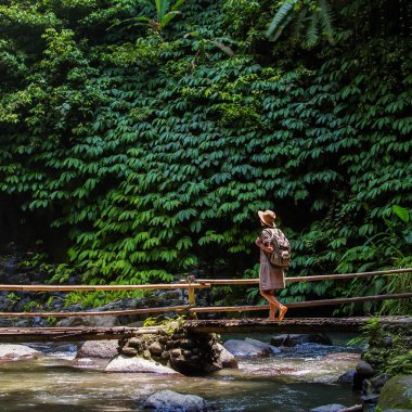 Woman near Nung Nung waterfal on Bali, Indonesia