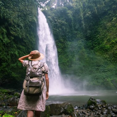 Woman near Nung Nung waterfal on Bali, Indonesia
