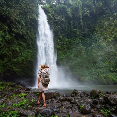 Woman near Nung Nung waterfal on Bali, Indonesia