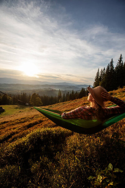 Woman Hiker Resting Climbing Hammock Sunset Stock Photo
