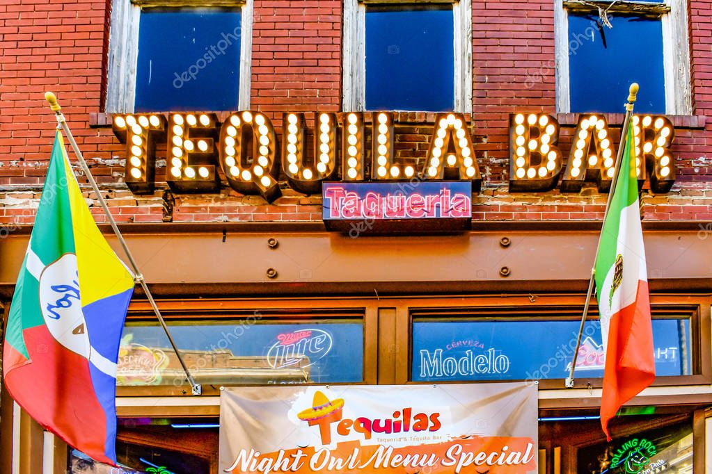 Ybor City Tampa Bay, Florida. January 19 , 2019 Tequila Bar and Colorful flags in 7th Ave
