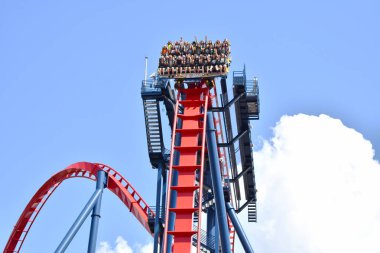 Tampa, Florida. October 06, 2018 . People having fun Extreme Sheikra Rollercoaster at Bush Gardens Tampa Bay clipart