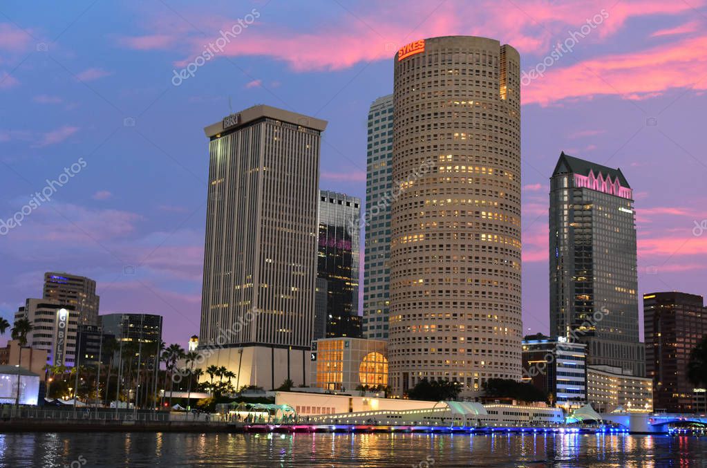 Tampa, Florida. October 06, 2018 . Downtown Skyscrapers with colorful iluminated dockside on beatiful sunset. 1.