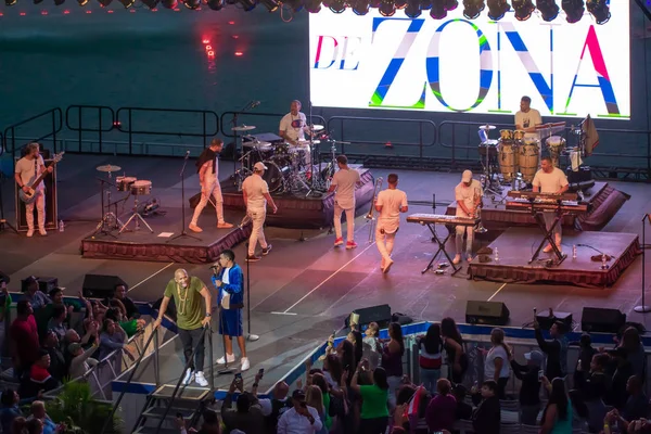 Orlando, Florida. March 17, 2019. Alexander Delgado taking a breath and Randy Malcom singing by Gente de Zona, while the band is still at Seaworld in International Drive Area. — Stock Image Orlando Florida March 2019 Alexander Delgado Taking Breath Randy Malcom Royalty Free Stock Images