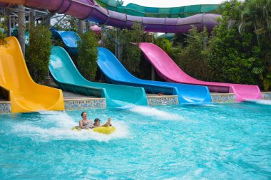 Orlando, Florida. April 07, 2019. People having fun Omaka Rocka. It is a water slide at Aquatica (7) clipart