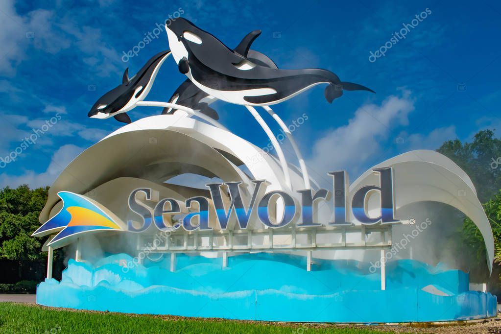 Orlando, Florida. June 17, 2019. Seaworld sign and whale figures on lightblue cloudy background 3.