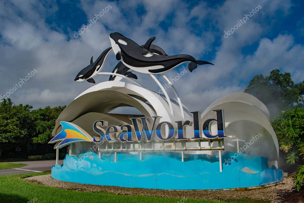 Orlando, Florida. June 17, 2019. Seaworld sign and whale figures on lightblue cloudy background 2