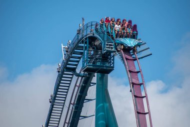 Orlando, Florida. July 29, 2019. People having fun riding Mako rollercoaster during summer vacation at Seaworld 88 clipart