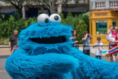 Orlando, Florida. August 28, 2019. Cookie Monster dancing in Sesame Street Party Parade at Seaworld (2). clipart