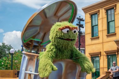 Orlando, Florida. August 28, 2019. Oscar the Grouch in Sesame Street Party Parade at Seaworld (3). clipart