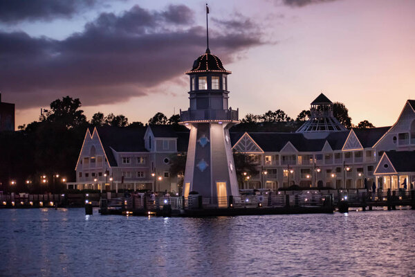 Orlando, Florida. October 11, 2019. Lighthouse and villas con colorful sunset backgrund at Lake Buena Vista (58).