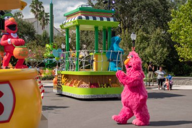 Orlando, Florida. October 24, 2019. Telly Monster in Sesame Street Party Parade at Seaworld 3 clipart