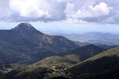 Hiking on mountains in Sierra de Grazalema Natural Park, province of Cadiz, Andalusia, Spain, towards Benamahoma clipart