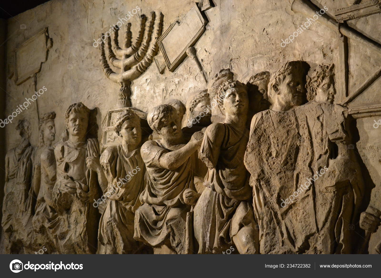 Wall relief on arch of titus depicting Menorah taken from temple in  Jerusalem in 70 AD - Israel history, Jewish war Stock Photo by ©graceenee  234722382