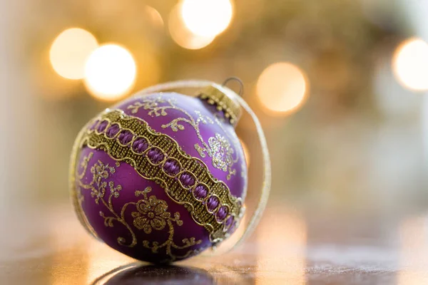 Purple and gold Christmas ball ornament