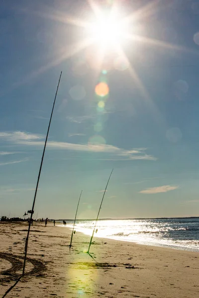 surf fishing rods summer afternoon east coast beach