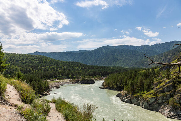 Coast of the mountain rivers Katun during high water in Altai, Russia