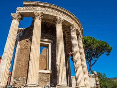 Circular Temple or Vesta on the banks of the river Aniene in Tivoli, Italy clipart
