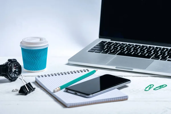 modern business tools on a wooden white background