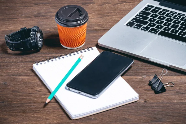 modern business tools on a brown wooden background