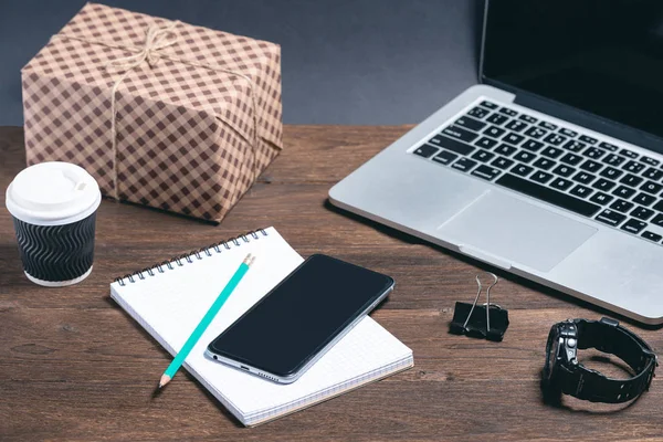 modern business tools on a brown wooden background