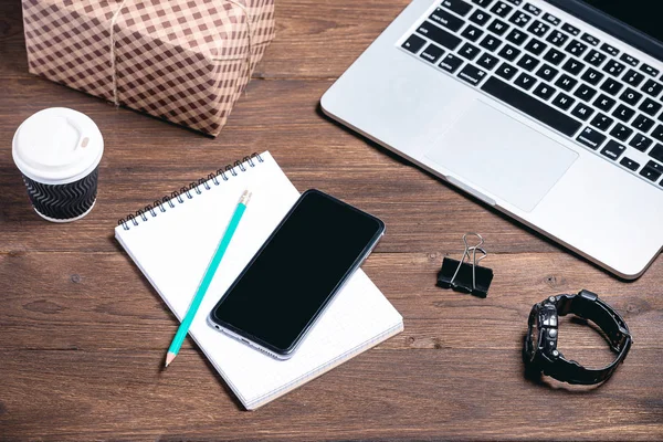 modern business tools on a brown wooden background