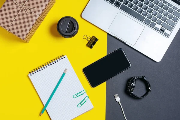 modern business tools on a yellow and black background with place for copy space