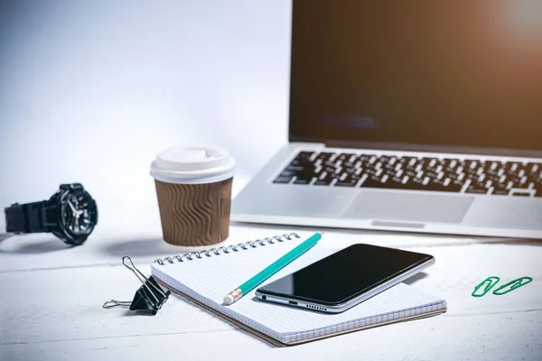 modern business tools on a wooden white background