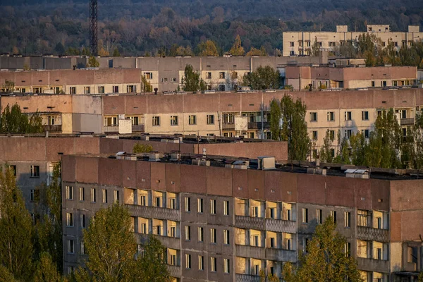 view of the autumn thrown city from the roof of high-rise buildings in the abandoned city