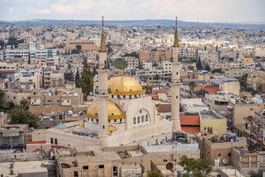 21/22/2019 Madaba, Ürdün, görünümü orta east.selective odak antik kentin yüksek minare ile merkezi ve en büyük Camii