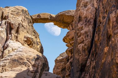 Burdah Rock Bridge in incredible lunar landscape in Wadi Rum in the Jordanian desert . Wadi Rum also known as The Valley of the Moon,  Jordan - Image