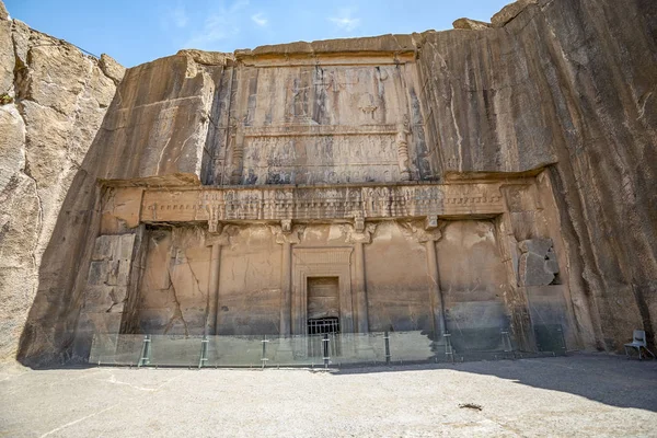 Tomb of Persian King, the Artaxerxes II. Zoroastrian symbol Faravahar, and king's soldiers, Persepolis, the ancient capital of old Persian Achaemenid Empire in Iran