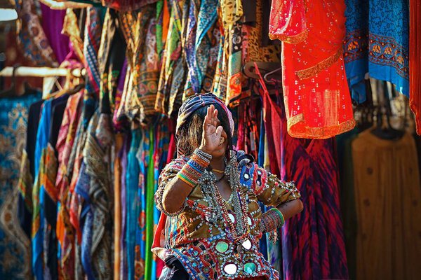 11/12/2019 India. Goa. Anjuna. Elderly Lambadi or Banjari Indian gypsy woman in traditional outfit with ornaments on Anjuna flea market. Lambadis are a nomadic community settled in various parts of India.