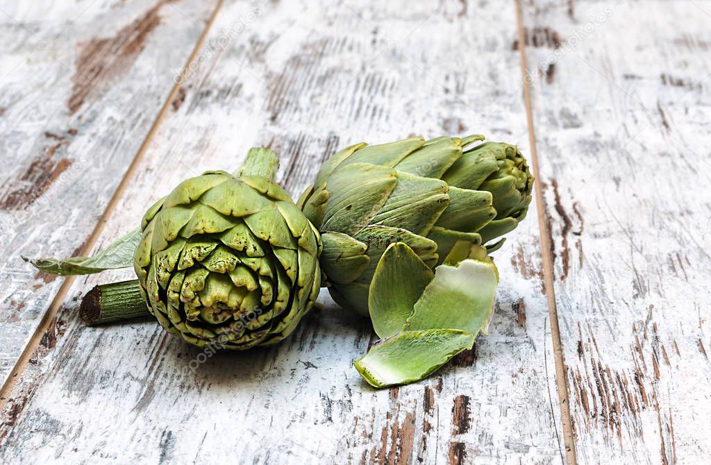 Artichokes surrounded by rustic background