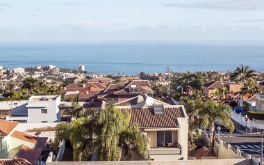 Village of La Orotava on the island of Tenerife with the sea in the background clipart