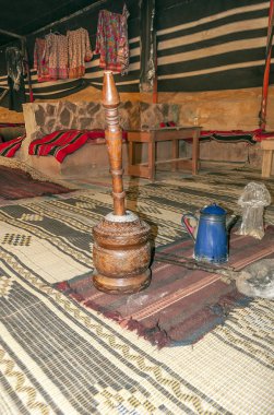 Coffee makers in Jordan surrounded by carpets.
