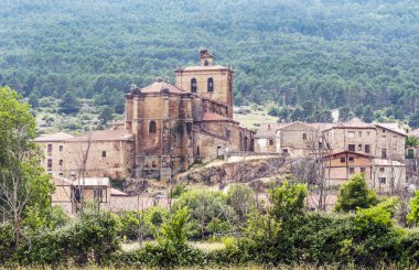 Vinuesa with its Romanesque church on a sunny day. It is a town in the province of Soria in Spain. clipart