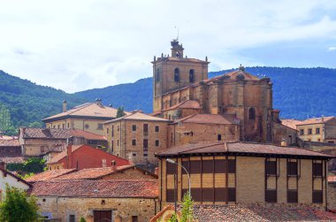 Vinuesa with its Romanesque church on a sunny day. It is a town in the province of Soria in Spain. clipart