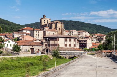 Vinuesa with its Romanesque church on a sunny day. It is a town in the province of Soria in Spain. clipart