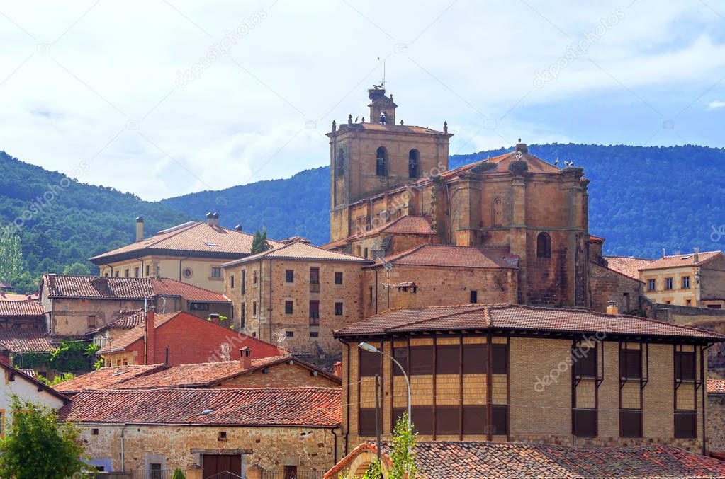 Vinuesa with its Romanesque church on a sunny day. It is a town in the province of Soria in Spain.