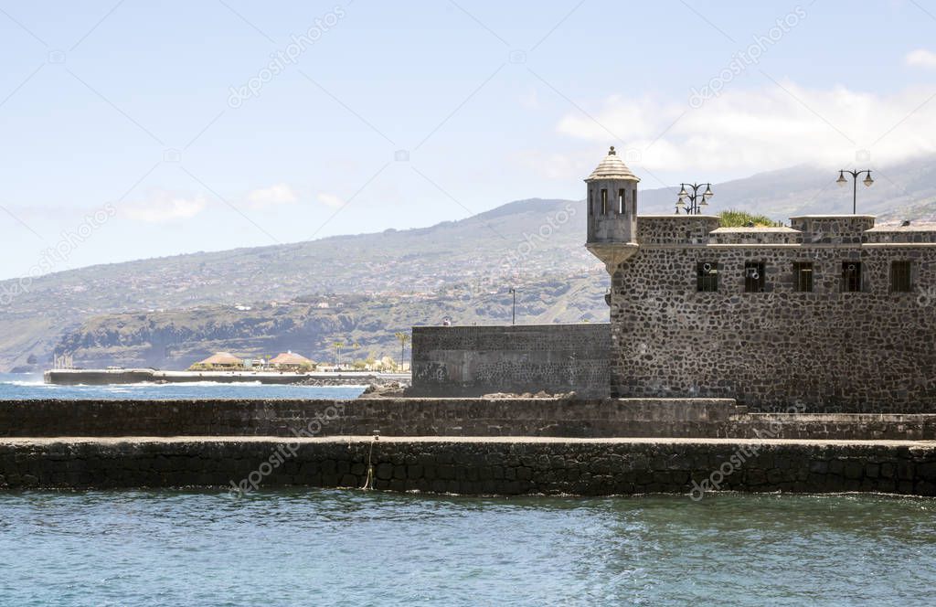 The castle of San Felipe is a building of originally defensive character located in the city of Puerto de la Cruz, in the north of the island of Tenerife. It is by the sea on a sunny day.
