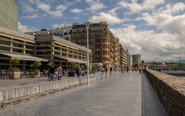 SAN SEBASTIAN, SPAIN - SEPTEMBER 2018. Streets next to the beach of La Concha in San Sebastian with people walking in them.