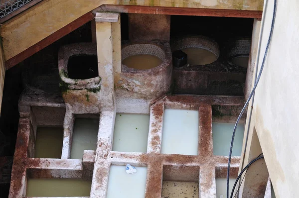 liming vats in old tannery in Fez, Morocco