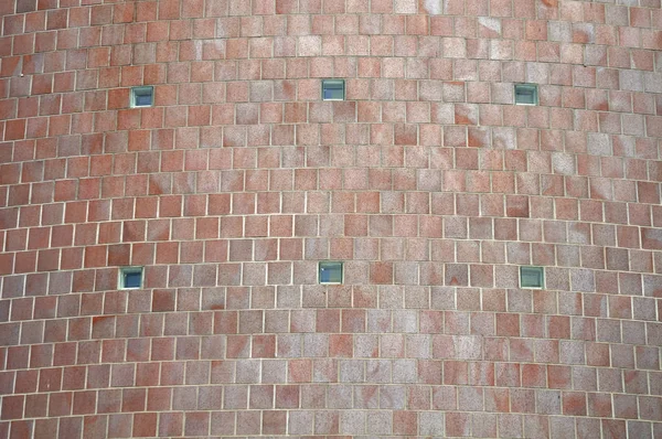 Curved facade covered with brown glazed bricks — Stock Photo, Image