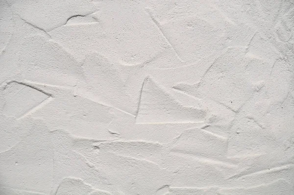 Surface rugueuse d'un mur plâtré peint en blanc — Photo