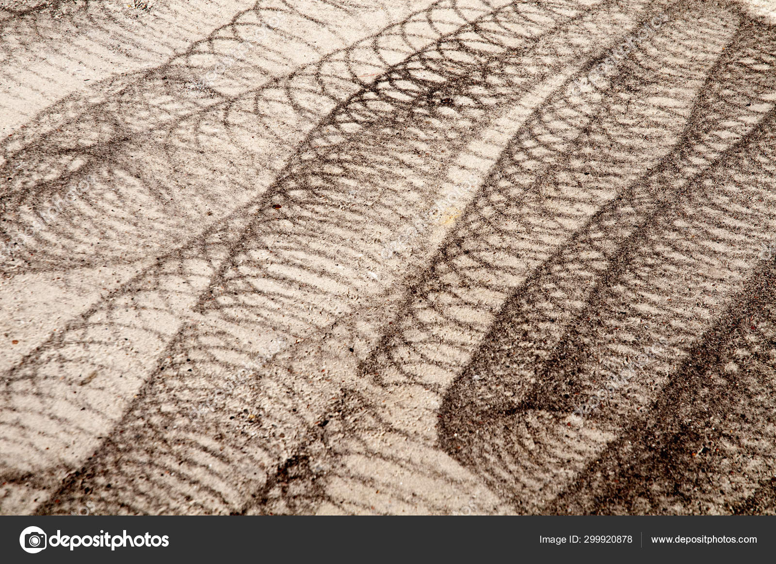 Rubber Tracks Of A Sweeping Machine On Cement Floor Stock Photo