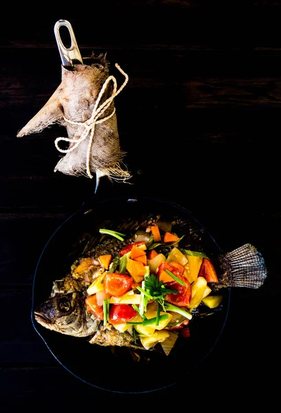 Thai Fried Fish and Topped with Fried Stir Sweet and Sour: One of the art of Thai cooking. This is a well known Thai food.